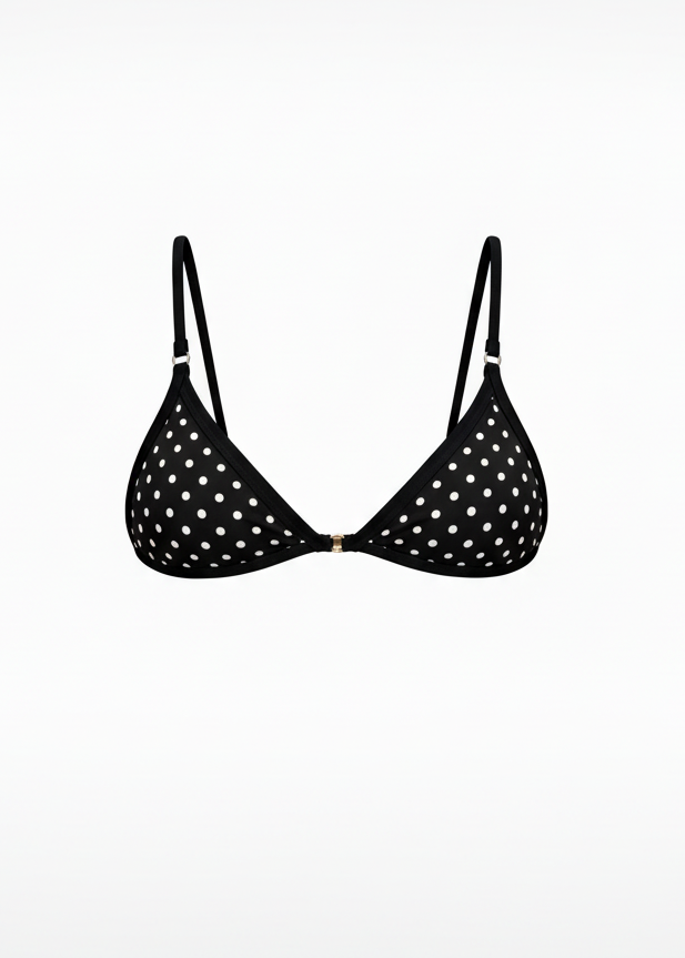 Black polka dot bra on a white background