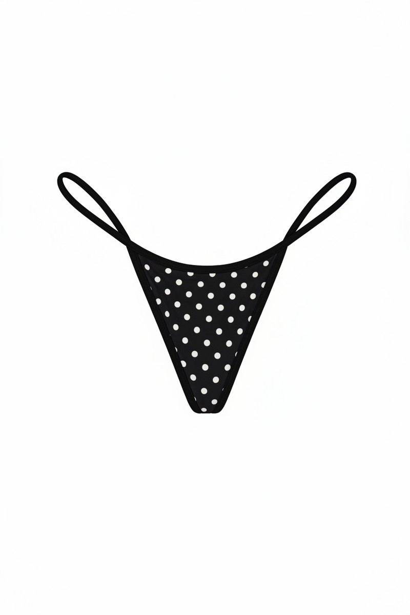 Black polka dot thong on a white background